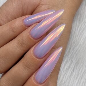 Julie’s long lavender-pink stiletto nails with Fire Chrome reflecting peach, orange, and gold against white fur.