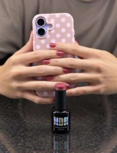 Raspberry holographic gel polish with deep berry shimmer by Nails Done Right