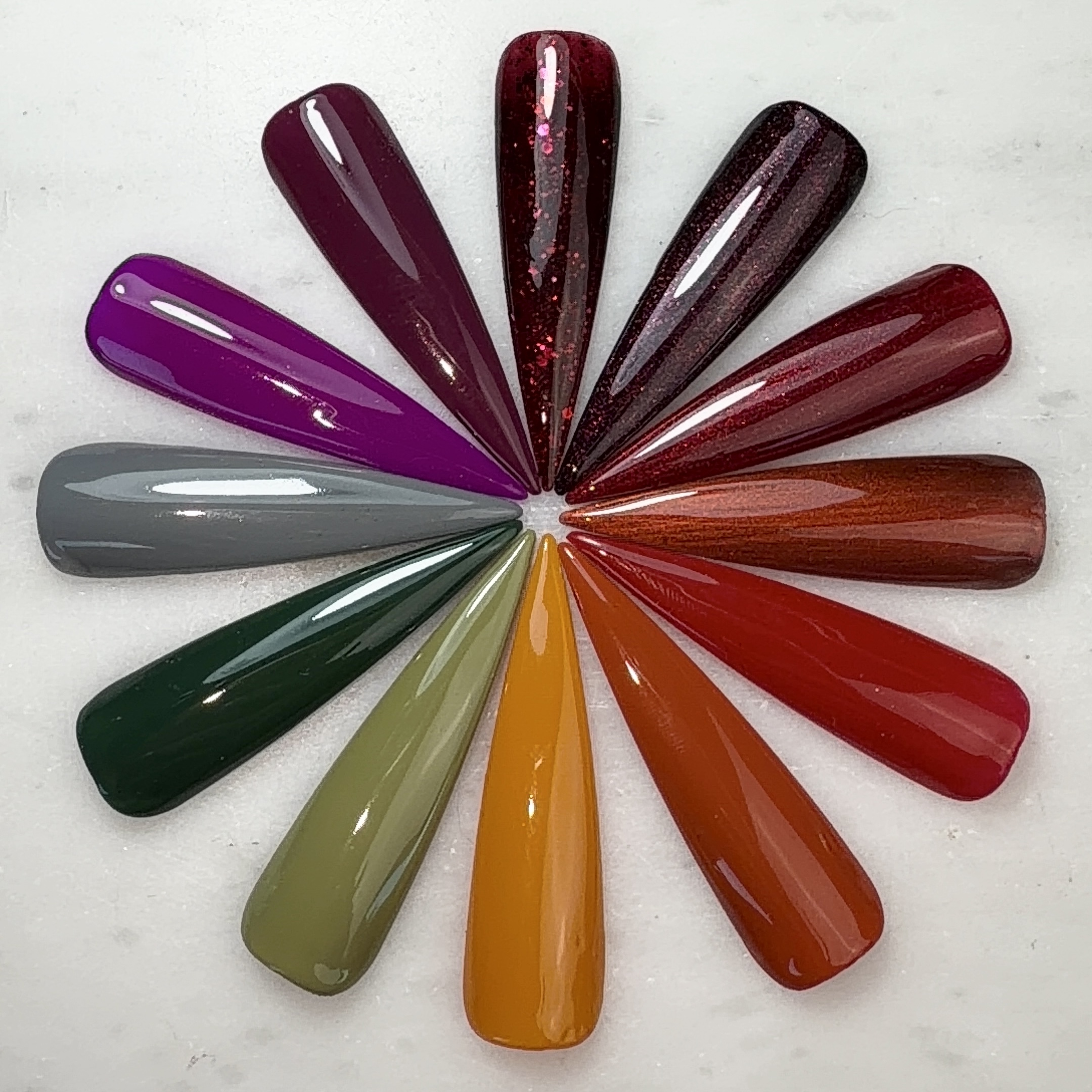 Painted nail tips featuring Nails Done Right fall gel polish colors